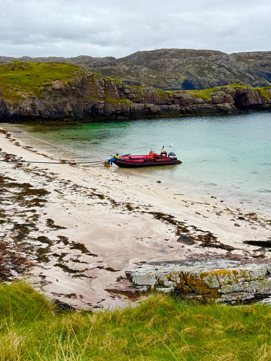 The ferry boat waiting on the sand